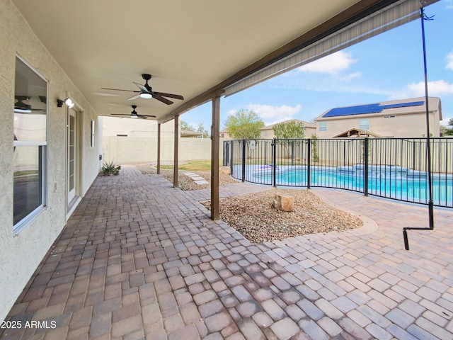 view of patio with ceiling fan, a fenced backyard, and a fenced in pool