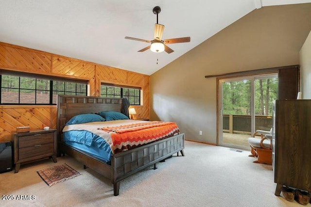 bedroom featuring light carpet, visible vents, access to outside, wood walls, and high vaulted ceiling