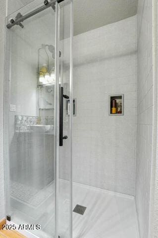 full bath with a shower stall