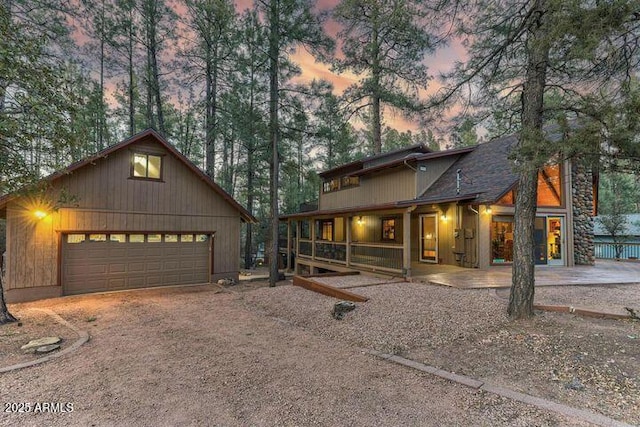 chalet / cabin featuring a detached garage