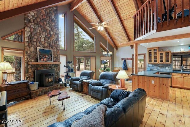 living area with wood ceiling, high vaulted ceiling, light wood-type flooring, and beam ceiling