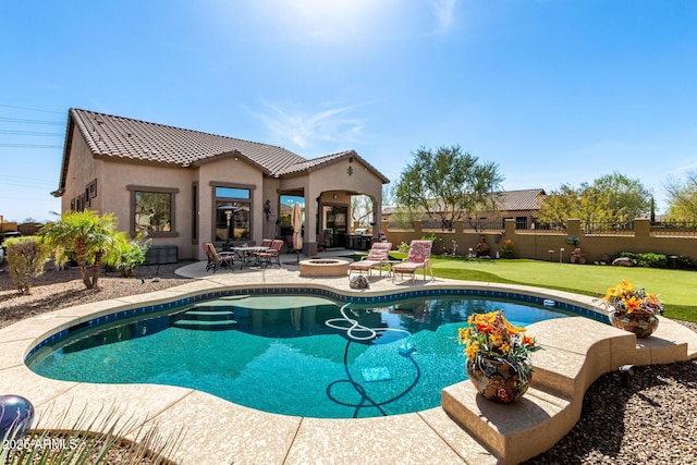 view of pool with a patio area, a fenced in pool, an outdoor fire pit, and fence