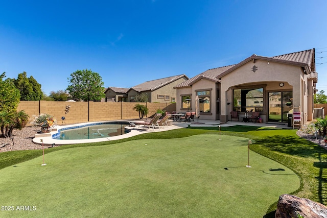 view of yard with a patio area, a fenced in pool, and a fenced backyard