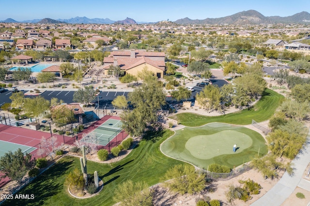 bird's eye view with a residential view, a mountain view, and view of golf course