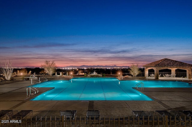 community pool featuring a gazebo and a patio area