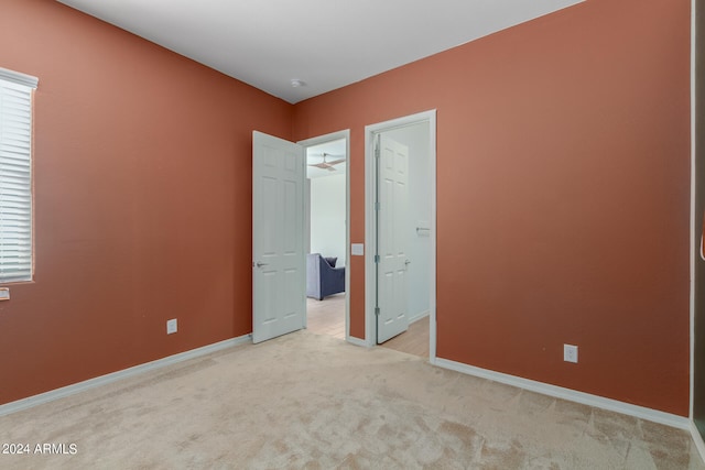 unfurnished bedroom with carpet