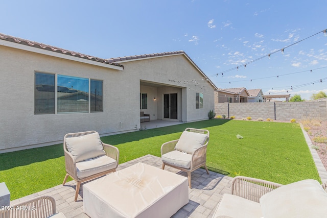 exterior space with a yard, outdoor lounge area, and a patio area