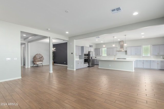 unfurnished living room with light wood-type flooring