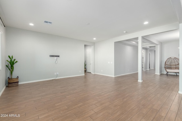 unfurnished living room featuring light wood-type flooring