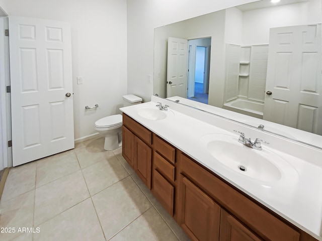 bathroom with tile patterned flooring, toilet, a bathing tub, and a sink