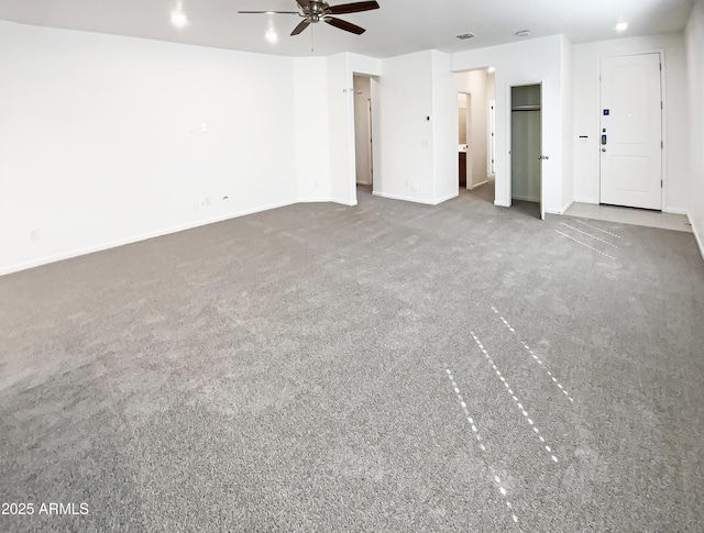 interior space featuring visible vents, baseboards, and carpet