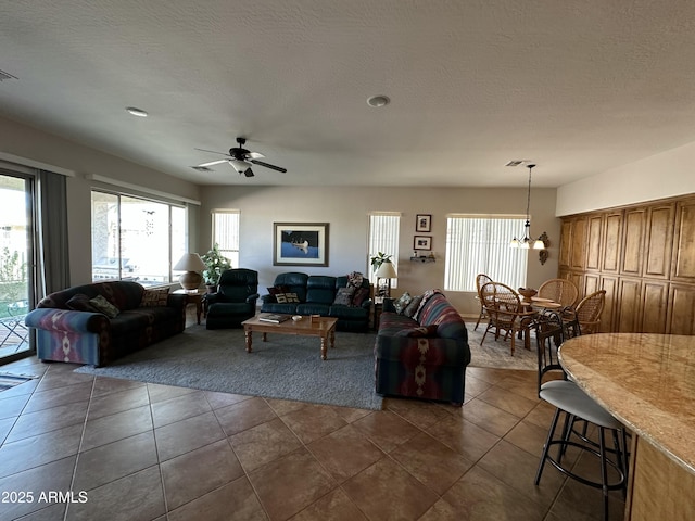 4116 E Sierra Sunset Trl, Cave Creek, AZ 85331 - living room with a textured ceiling, dark tile patterned floors, and plenty of natural light