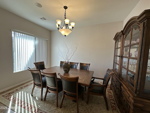 4116 E Sierra Sunset Trl, Cave Creek, AZ 85331 - dining area featuring a chandelier, visible vents, and baseboards
