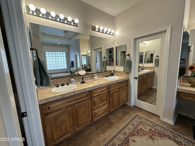 4116 E Sierra Sunset Trl, Cave Creek, AZ 85331 - bathroom featuring a bathtub, tile patterned floors, a sink, and double vanity