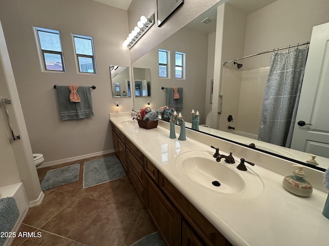4116 E Sierra Sunset Trl, Cave Creek, AZ 85331 - bathroom featuring double vanity, baseboards, toilet, tile patterned flooring, and a sink