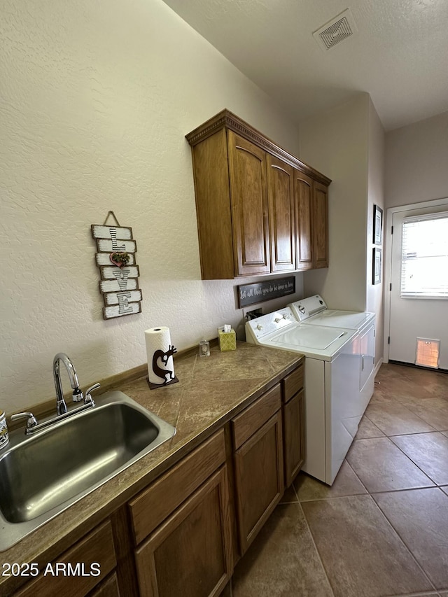 4116 E Sierra Sunset Trl, Cave Creek, AZ 85331 - laundry room with tile patterned flooring, washing machine and dryer, a sink, visible vents, and cabinet space