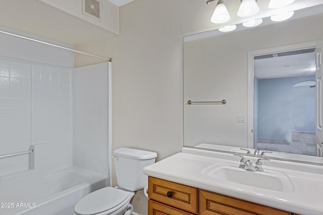 bathroom featuring visible vents, toilet, vanity, and  shower combination