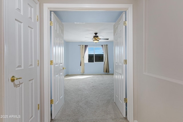 corridor with carpet flooring