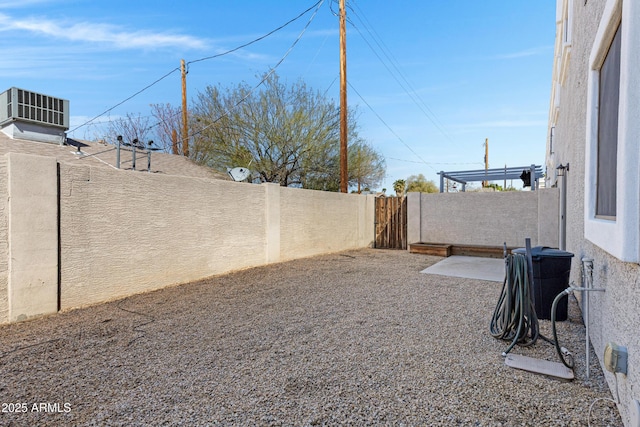 view of yard with cooling unit, a patio, and a fenced backyard