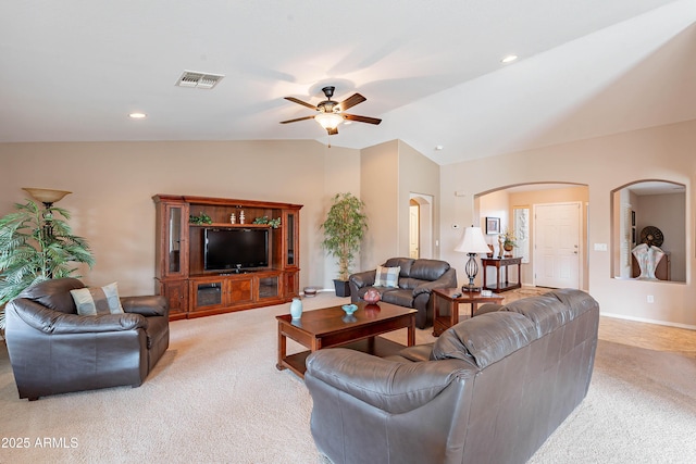 living room with ceiling fan, light carpet, and vaulted ceiling