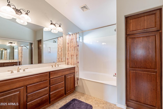 bathroom with tile patterned flooring, vanity, shower / tub combo with curtain, and vaulted ceiling