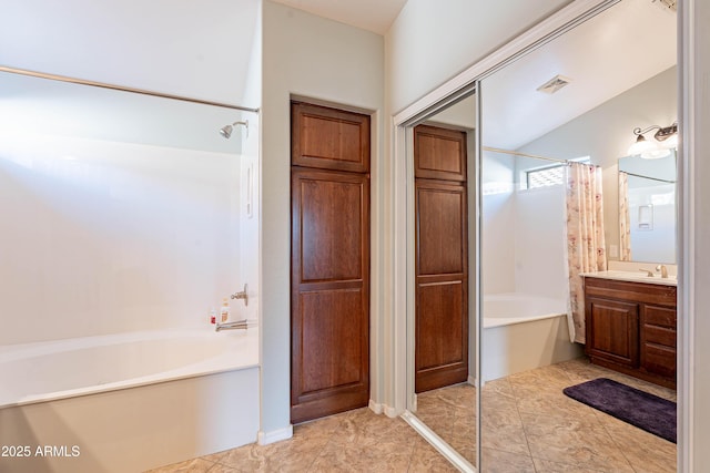 bathroom with tile patterned flooring, vanity, and shower / tub combo with curtain