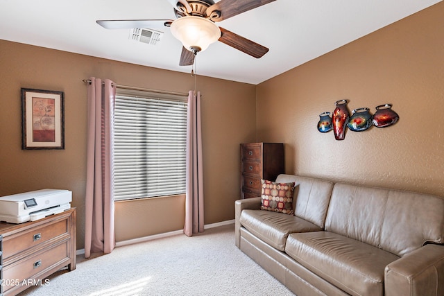 interior space with ceiling fan and light carpet