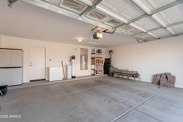 garage featuring a garage door opener and electric water heater