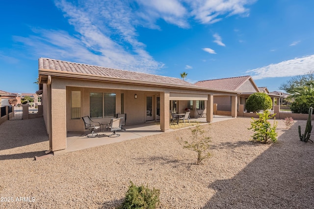 rear view of house featuring a patio