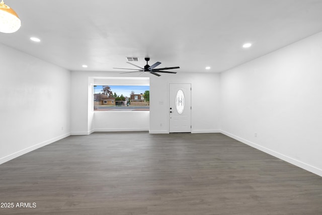 unfurnished living room with recessed lighting, visible vents, and dark wood finished floors