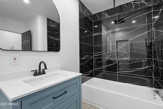 full bathroom with a combined bath / shower with rainfall shower, vanity, and wood finished floors