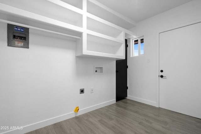 laundry area with hookup for a washing machine, wood finished floors, baseboards, laundry area, and electric dryer hookup