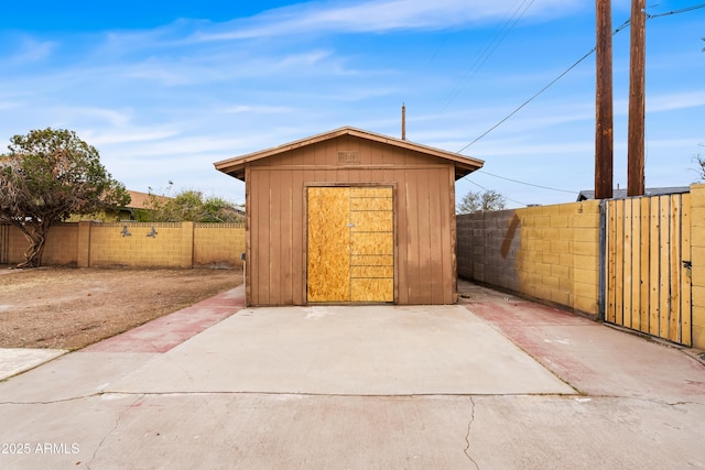 view of shed featuring a fenced backyard