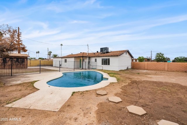 view of pool featuring a patio, cooling unit, a fenced backyard, and a fenced in pool