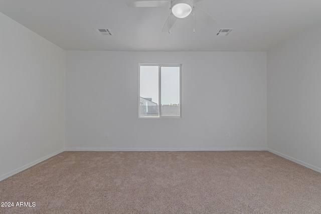 empty room with carpet floors and ceiling fan