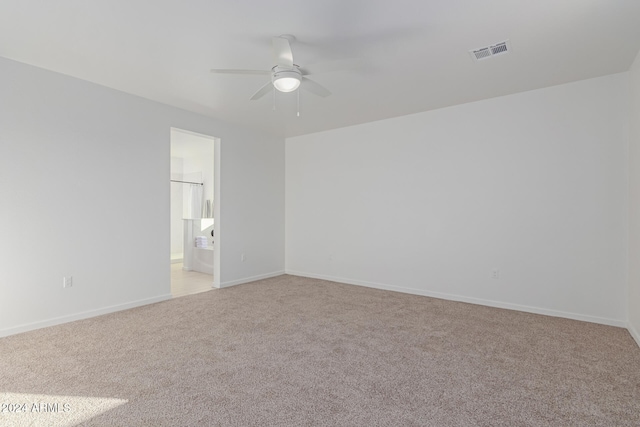 interior space featuring light colored carpet and ceiling fan