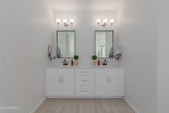 bathroom featuring hardwood / wood-style floors and vanity