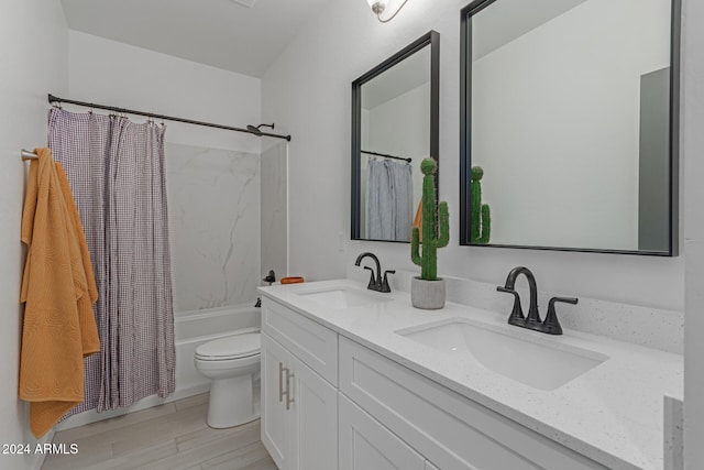 full bathroom featuring toilet, wood-type flooring, vanity, and shower / tub combo with curtain