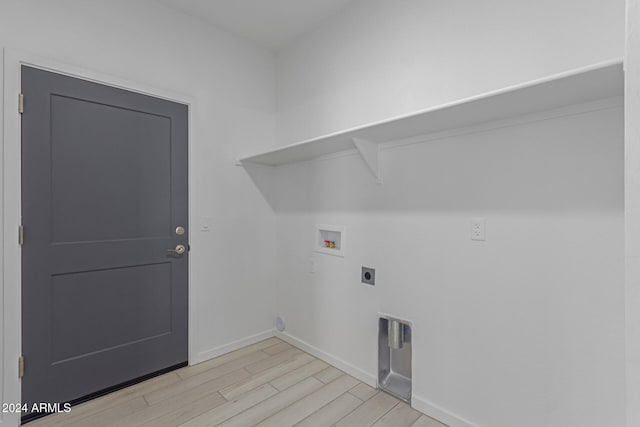 clothes washing area with hookup for an electric dryer, hookup for a washing machine, and light wood-type flooring