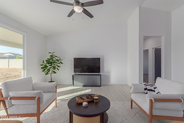 living room with ceiling fan and light wood-type flooring