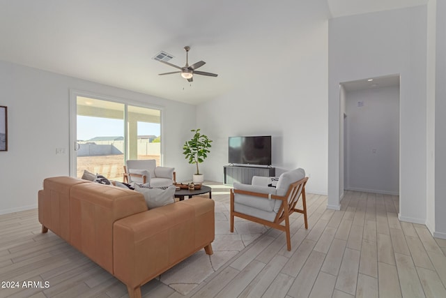 living room featuring ceiling fan and light wood-type flooring