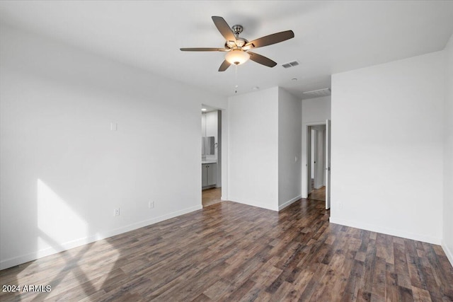 unfurnished room with ceiling fan and hardwood / wood-style flooring