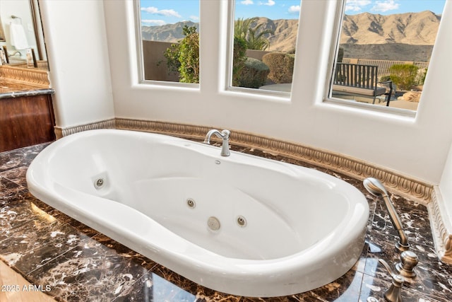 bathroom featuring a relaxing tiled tub