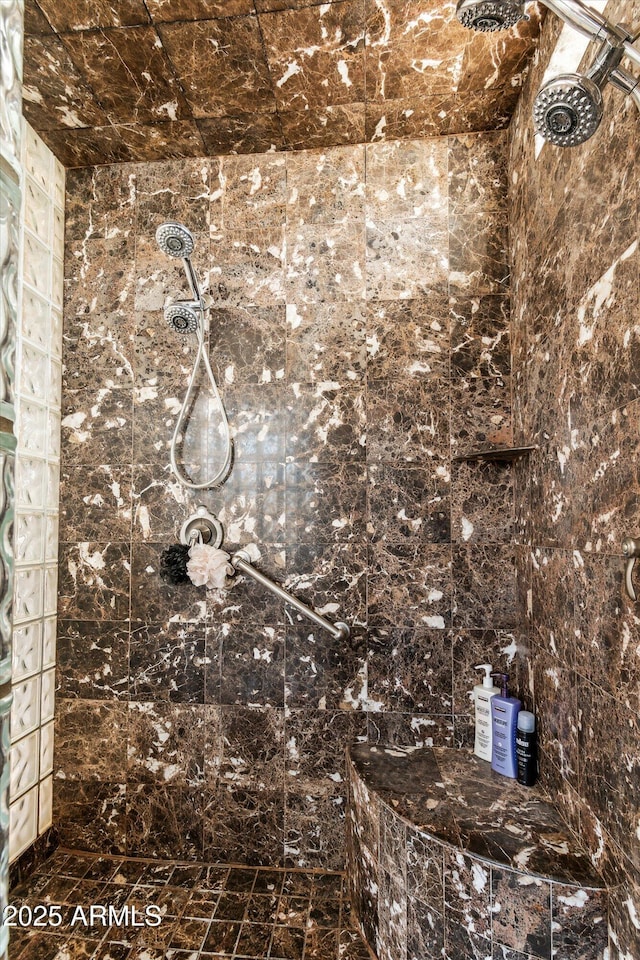 interior details with a tile shower