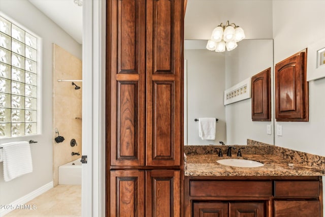 bathroom with vanity, tile patterned floors, and tiled shower / bath