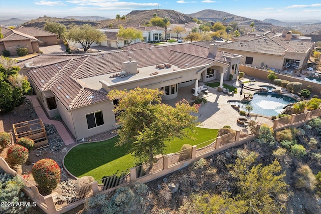 birds eye view of property with a mountain view