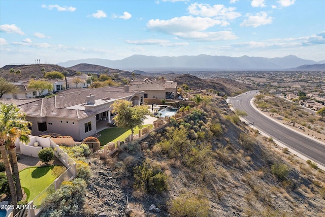 birds eye view of property featuring a mountain view