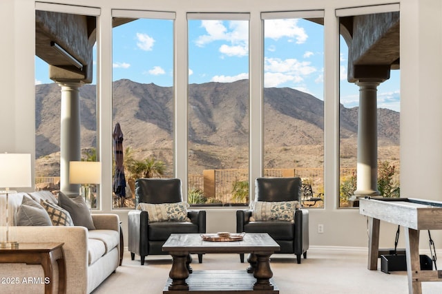 interior space featuring light carpet and a mountain view