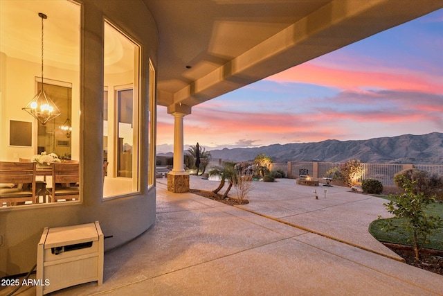 patio terrace at dusk with a mountain view