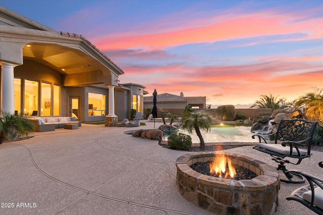 patio terrace at dusk with a fire pit